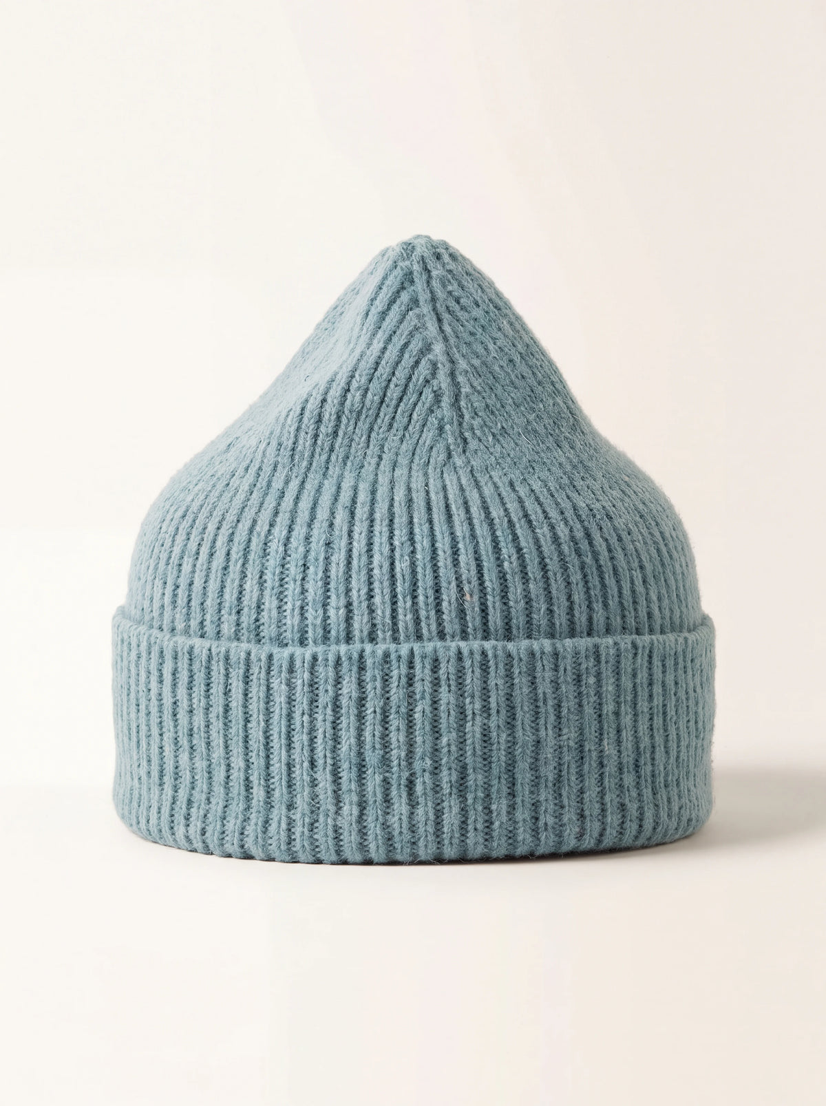 Ribbed wool beanie in muted light blue with a wide turn-up cuff