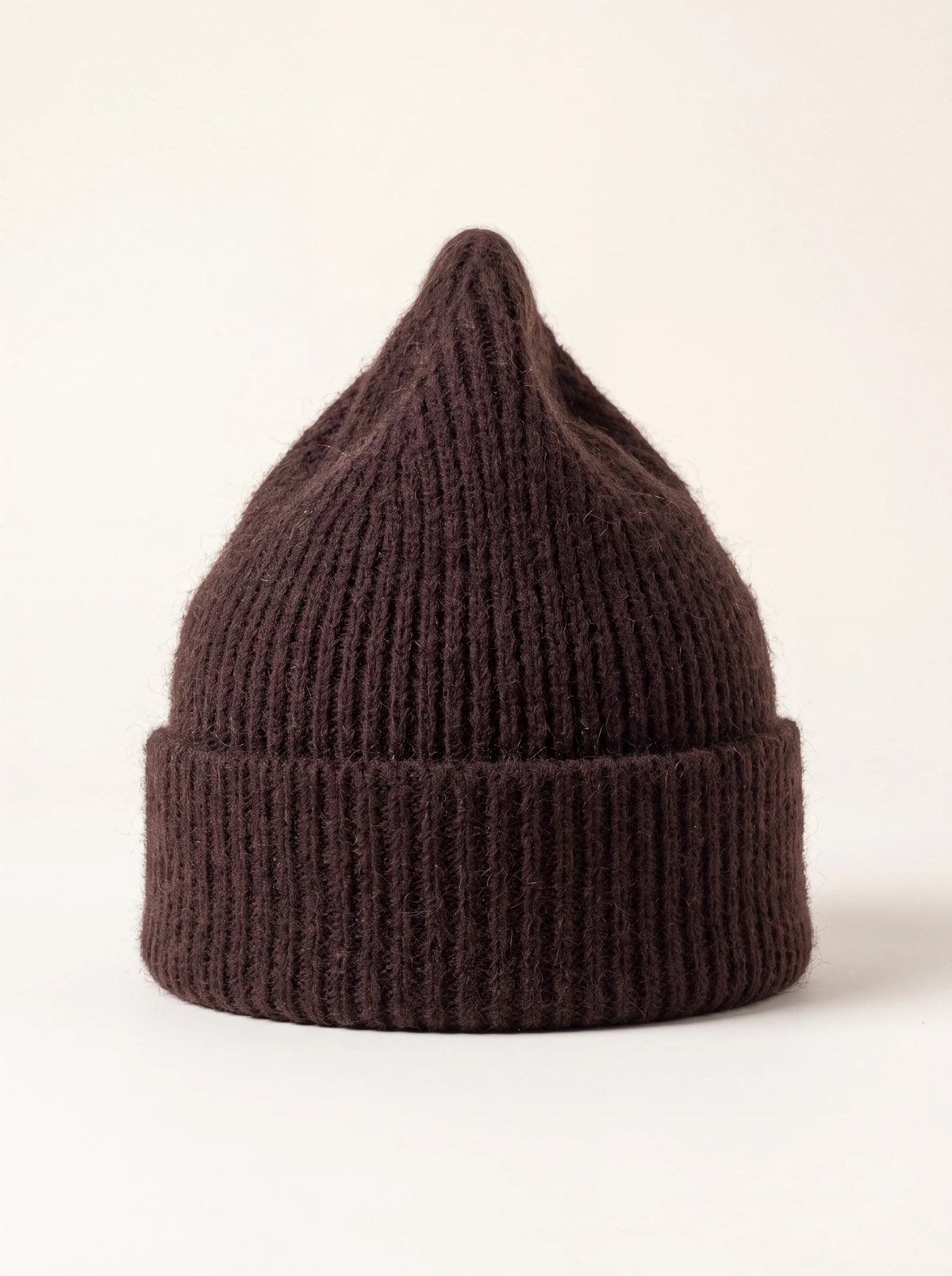 Espresso brown ribbed wool beanie with a folded cuff and tapered crown