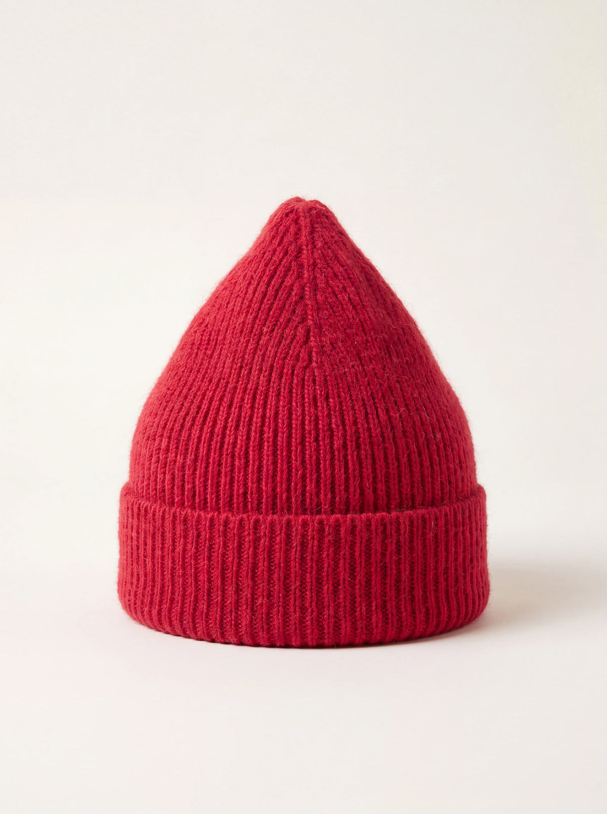 Ribbed knit wool beanie in framboise red with a turned-up cuff