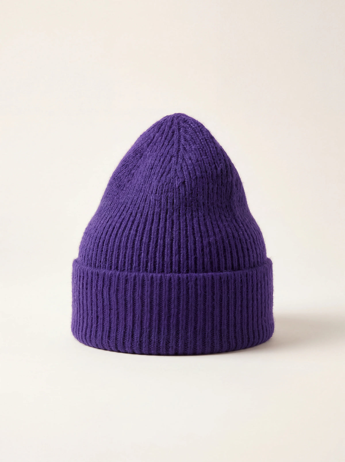 Indigo ribbed wool beanie with a wide turn-up cuff and tapered crown