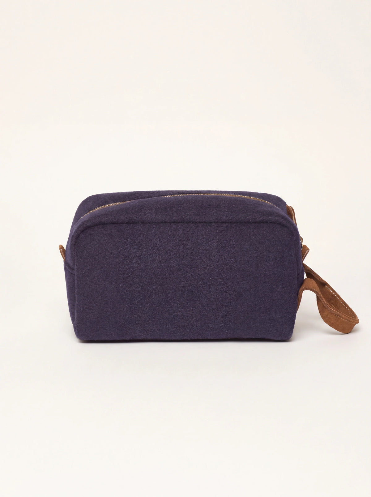 Blue wool felt beauty case with brown suede handle and zip closure