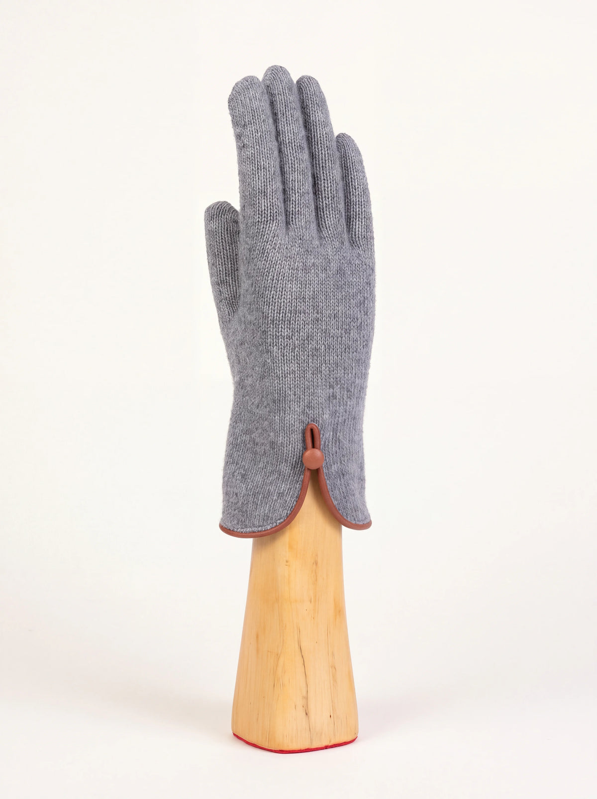 Grey wool and cashmere knit glove with a slit cuff, brown trim and a covered button