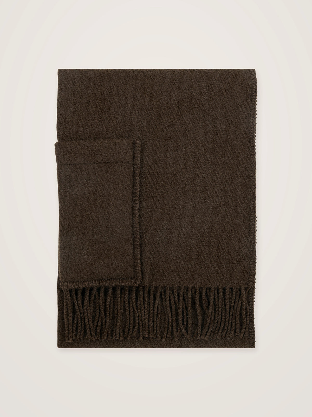 Woven pure new wool pocket shawl in chocolate brown, folded to show stitched edges and fringed hem