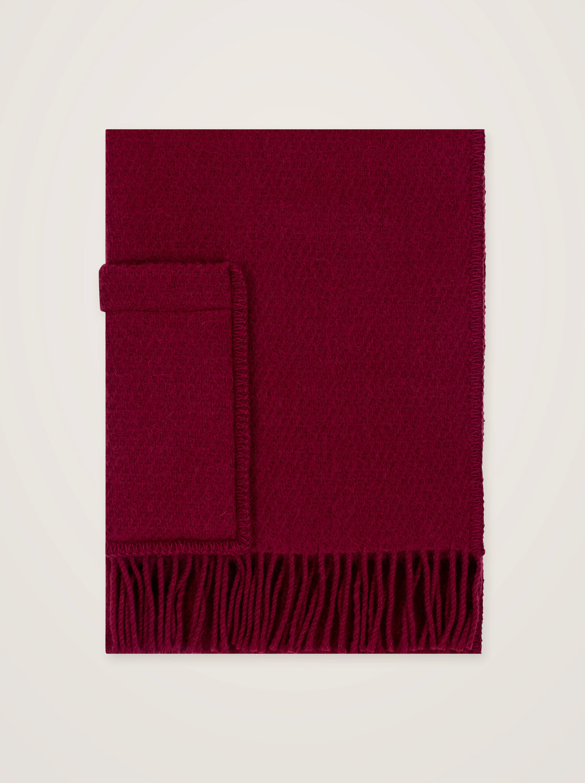Dark red pure new wool shawl with a patch pocket and fringe along the lower edge