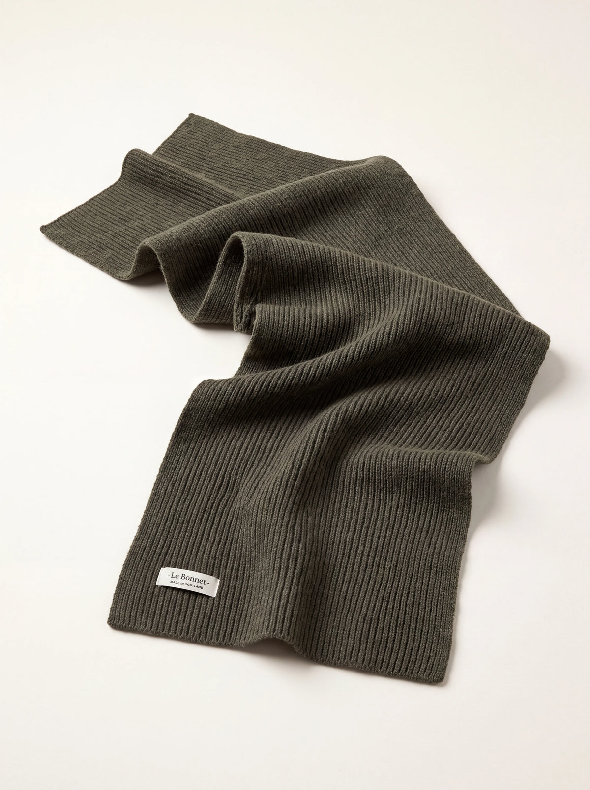Ribbed olive green lambswool scarf, with a woven label reading -Le Bonnet- MADE IN SCOTLAND