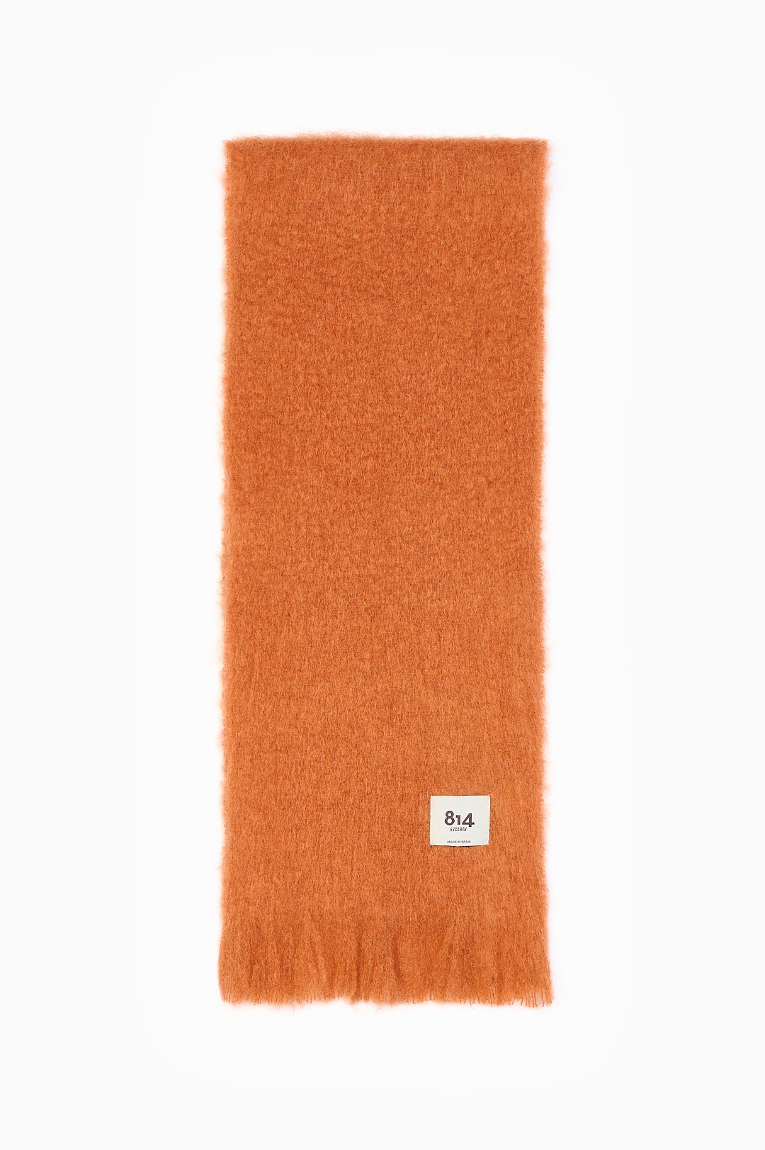 Orange mohair and wool scarf with a brushed texture, fringed end and stitched white 814 label