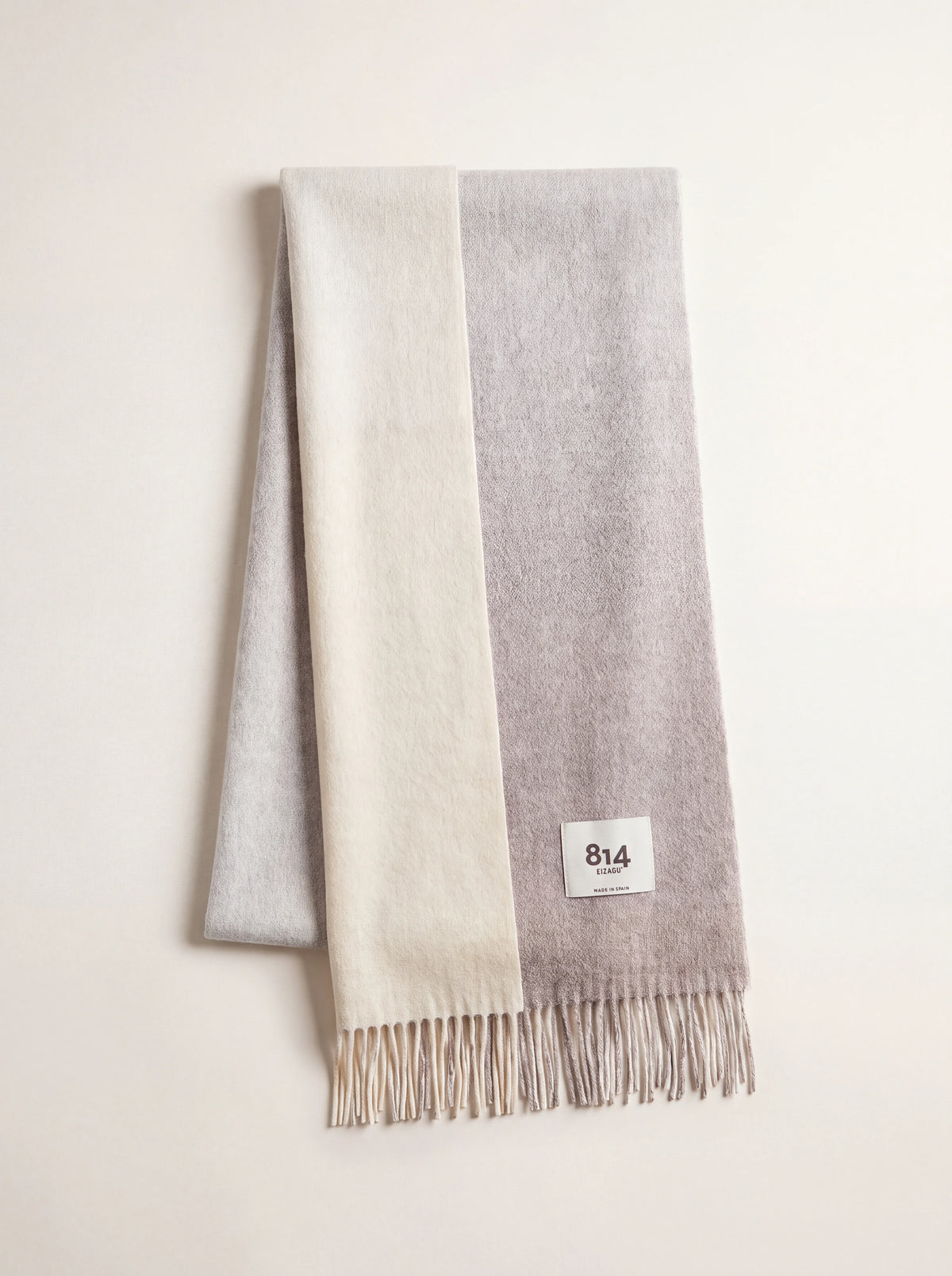 Merino wool scarf in gradient stone tones with fringed ends and an 814 Eizagu label